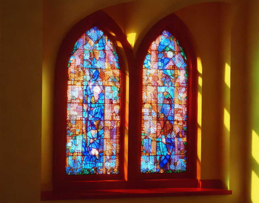 Vibrant stained glass windows casting colorful reflections