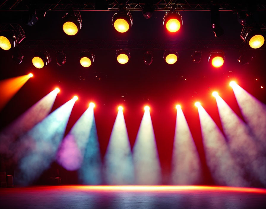 Colorful Spotlights Illuminate Misty Stage