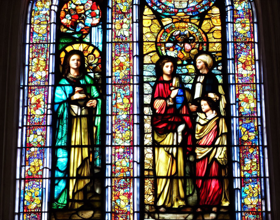 Colorful Stained Glass Window Featuring Biblical Figures and Floral Patterns