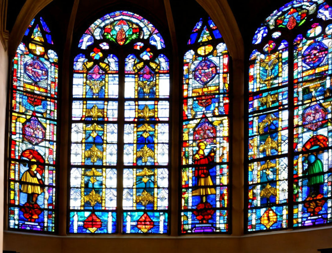 Colorful Gothic Arch Stained Glass Window in Stone Wall