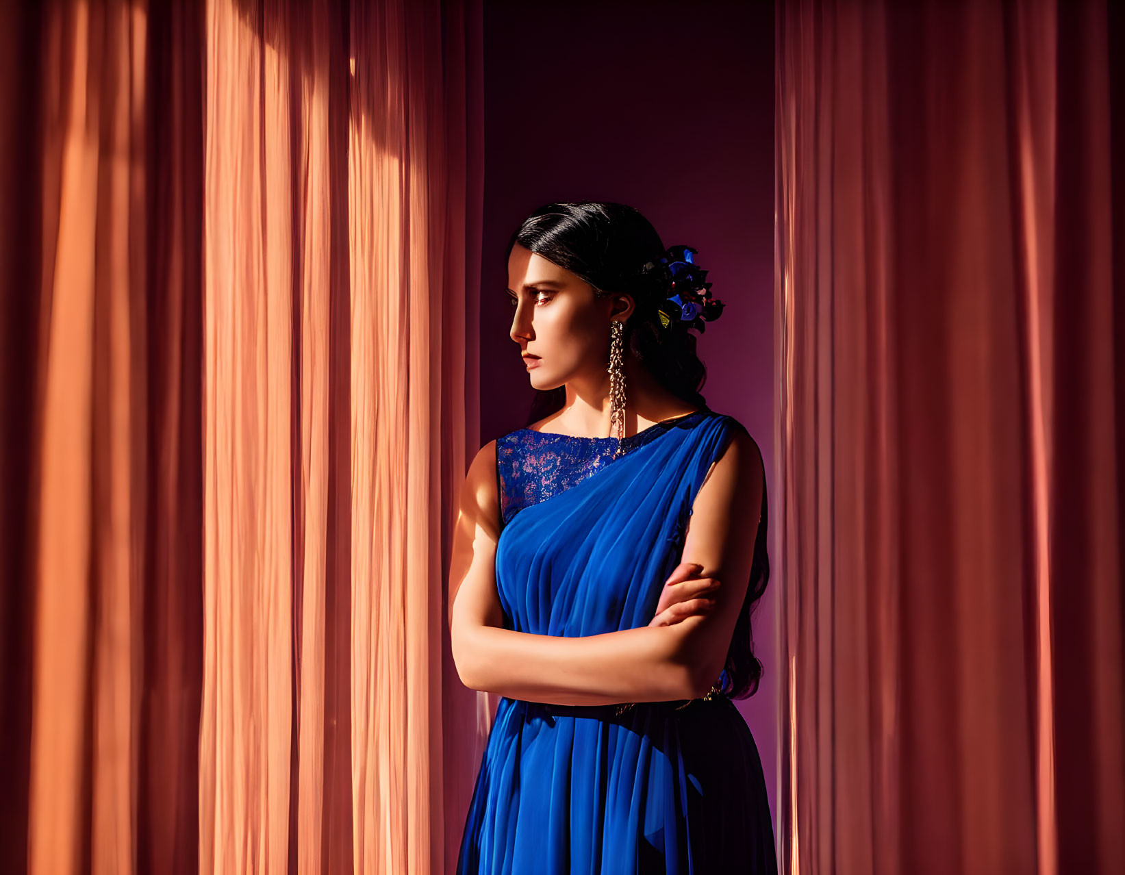 Woman in Blue Dress by Window with Flowers in Hair and Sunlight Shadows