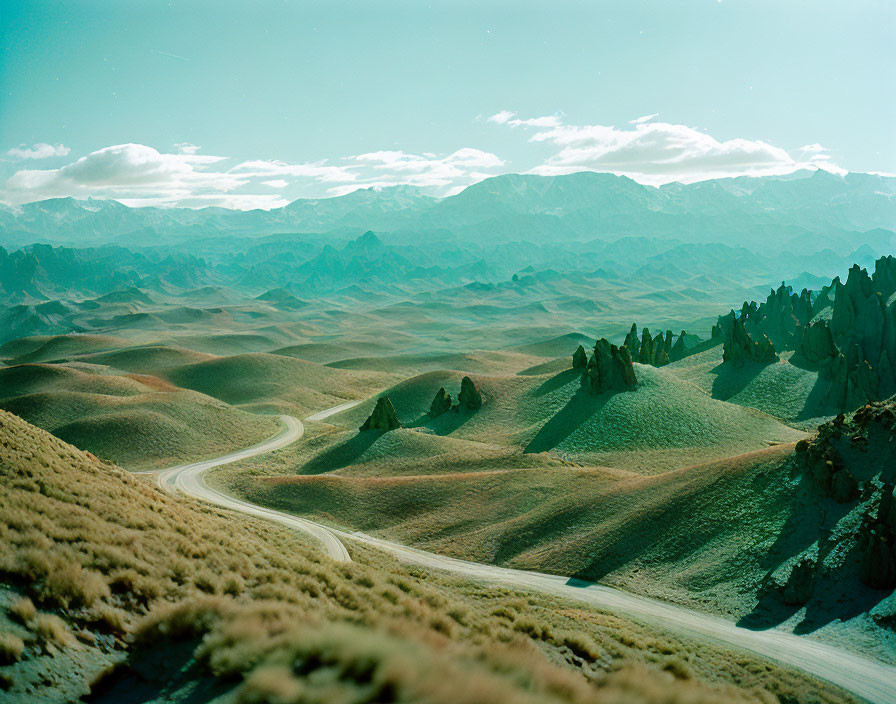 Scenic winding road through rugged hilly landscape