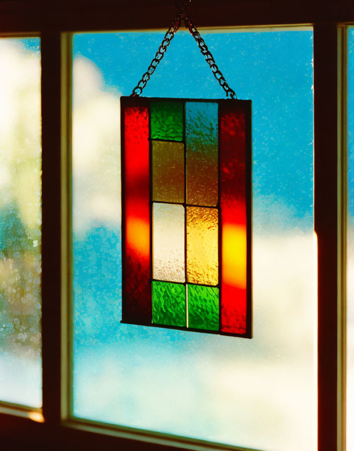 Colorful Stained Glass Window with Red, Green, and Clear Panes