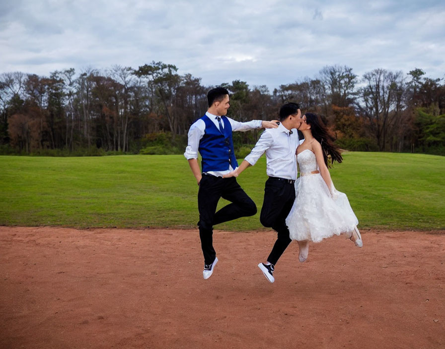 Joyful couple dancing on dirt pathway with lush green backdrop