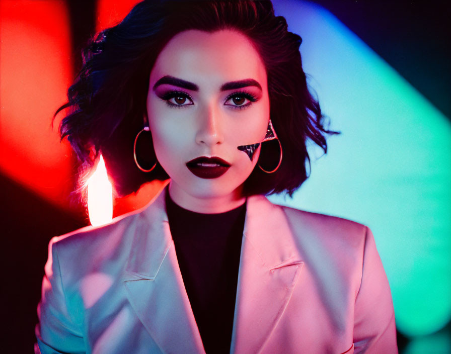 Bold makeup woman in white blazer with neon lights