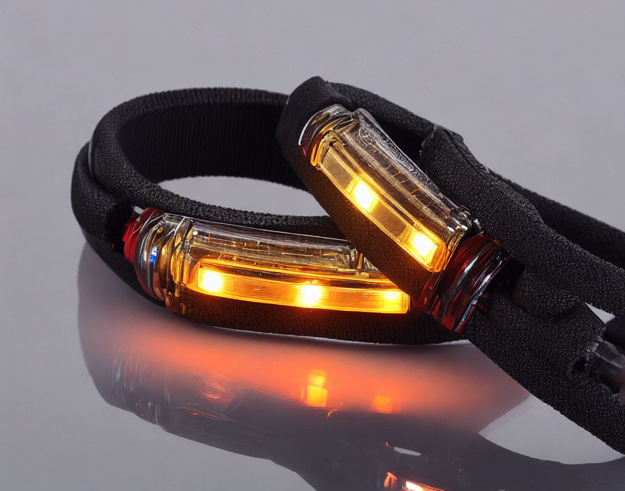 Amber Glowing Headlamp on Reflective Surface