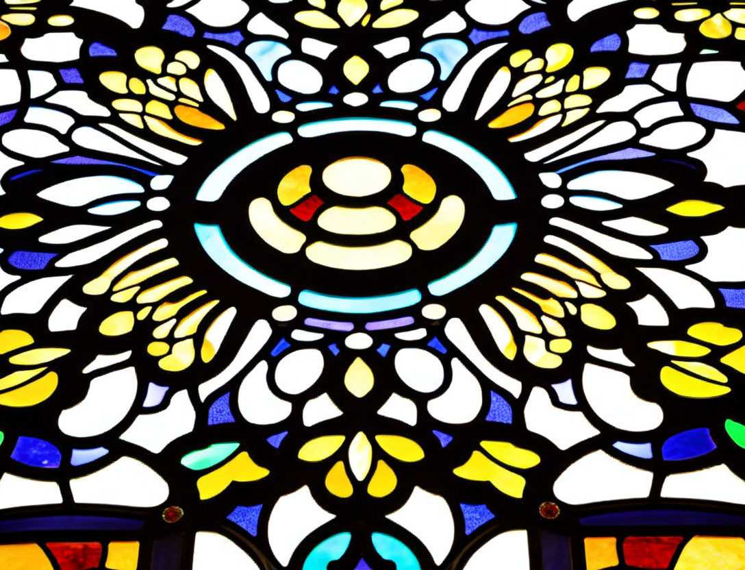 Symmetrical floral pattern in vibrant stained glass window