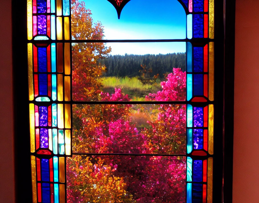 Colorful stained glass window showcasing lush meadow with trees and pink shrubs