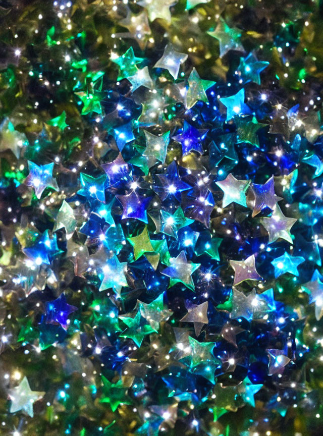 Shimmering star-shaped glitter in blue, green, and silver