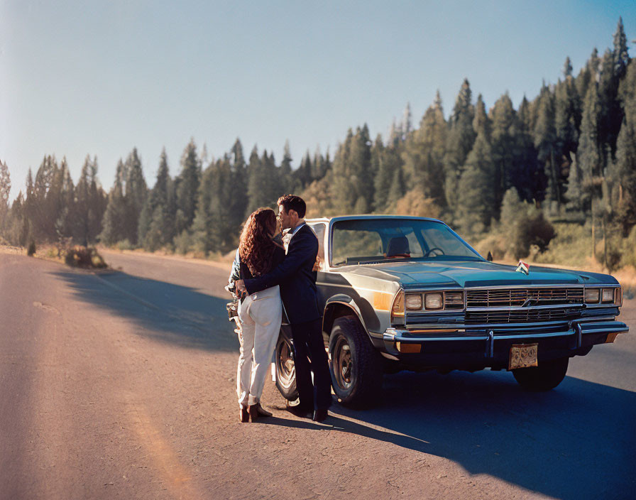 Couple Embracing by Classic Car on Forest Road