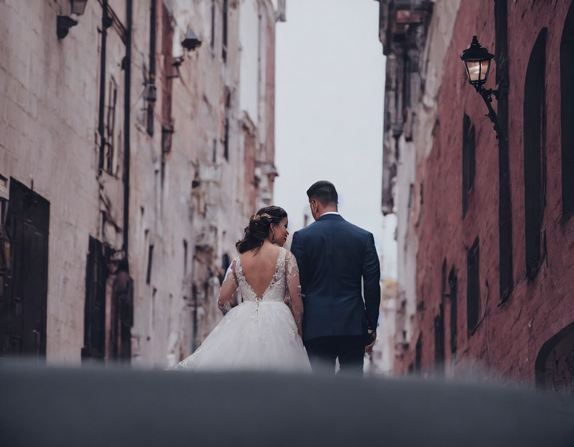 Bride and Groom Walking Down Vintage Street with Lamps