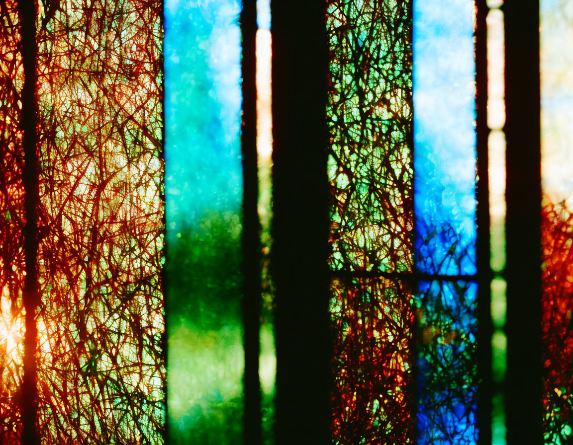 Colorful Light Patterns Through Textured Glass: Abstract Image with Shadows and Hues