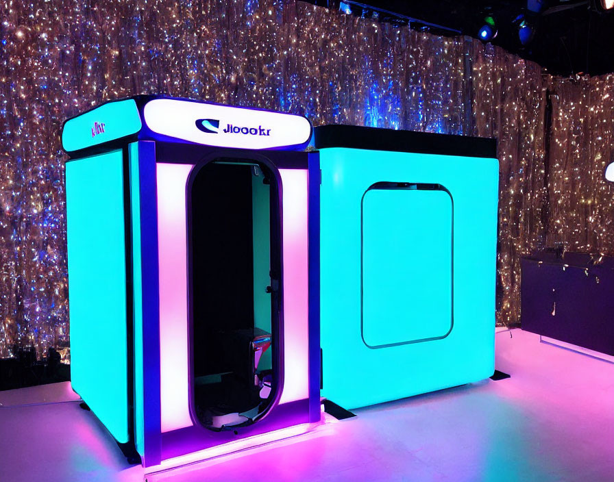 Colorful LED-lit modern photo booth with twinkling light backdrop