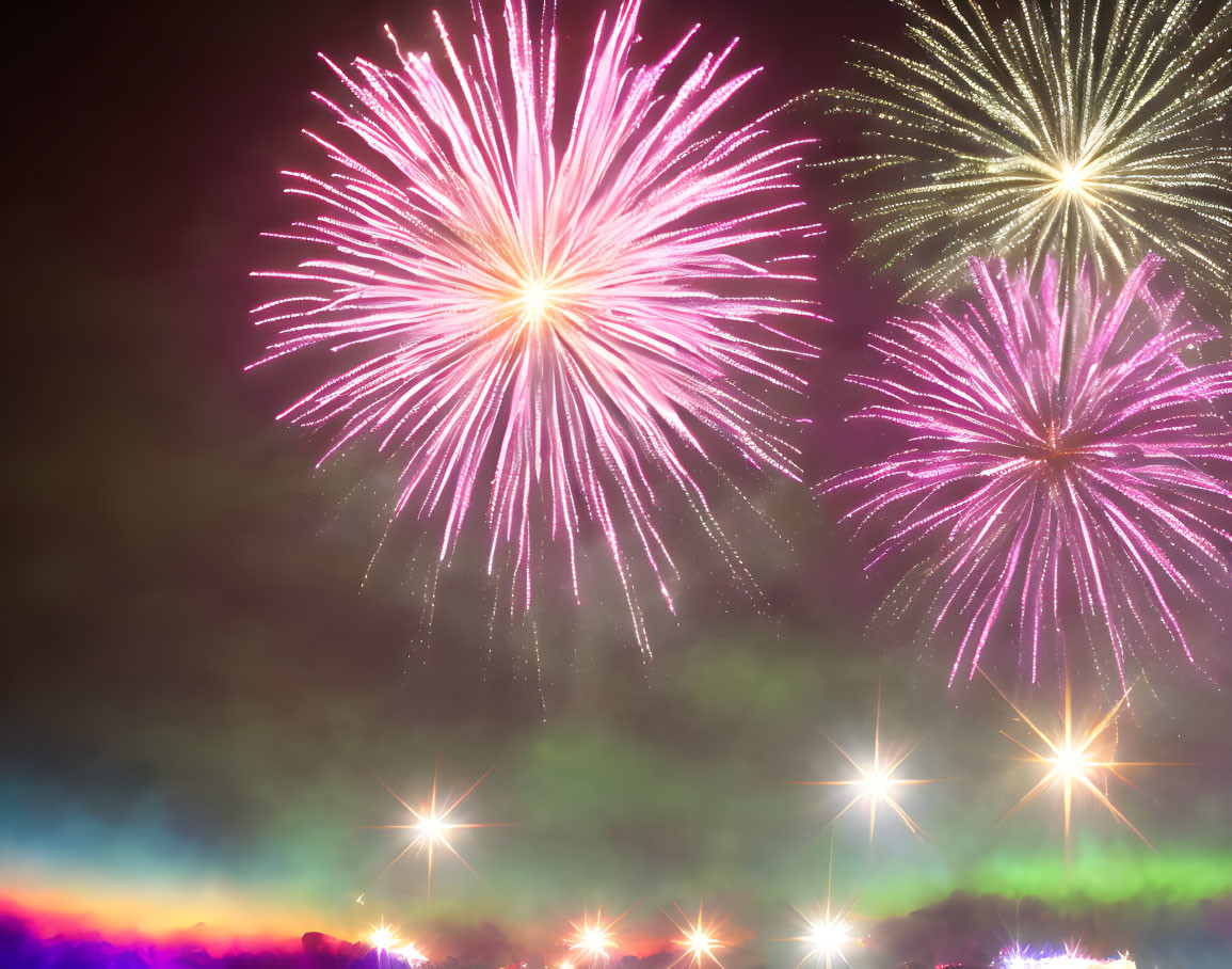 Colorful Pink and White Fireworks Display in Night Sky