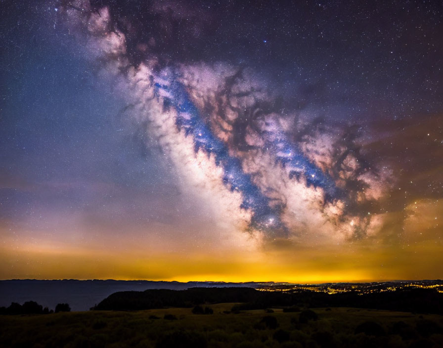 Stunning Milky Way galaxy over city lights at night