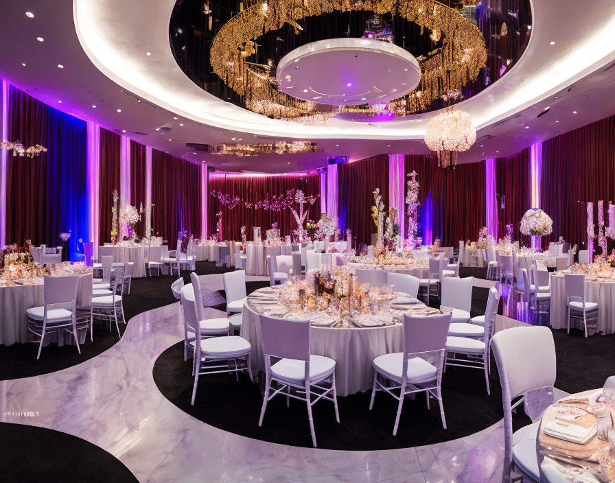 Luxurious Event Space with White Tables, Gold Settings & Lavish Decor