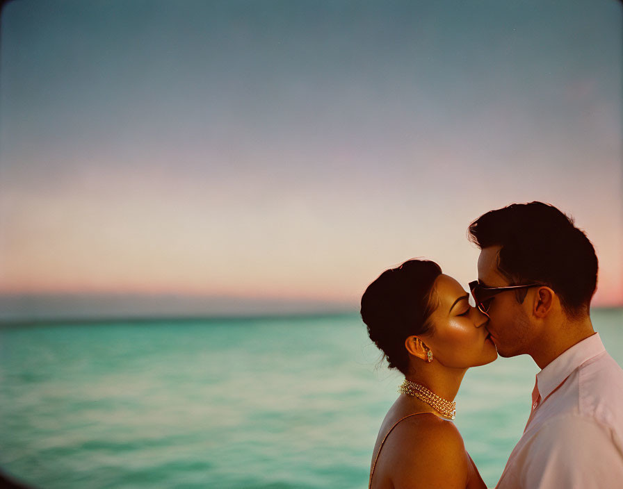 Romantic sunset kiss by the sea with pastel sky