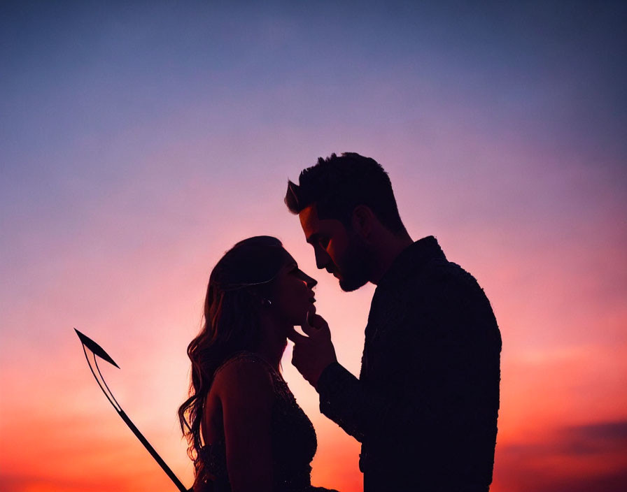 Silhouette of couple touching foreheads at sunset with Cupid's arrow