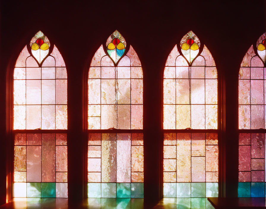 Vibrant stained glass windows with arched tops and circular designs.