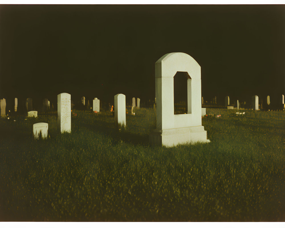 Cemetery Night Scene with Tombstones and Arch-shaped Headstone