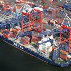 Colorful Cargo Ship Sailing Through Turbulent Seas