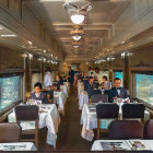 Luxurious Dining Car on Train with Formal Attire Passengers & Ornate Interior