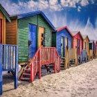 Colorful Beach Huts with Wooden Stairs at Twilight