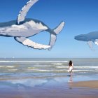 Surreal image of girl and floating whale on beach