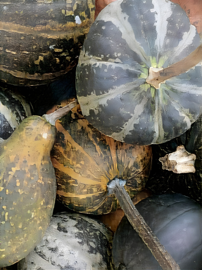 some pumpkins painted with gold and silver 