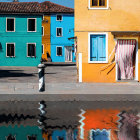 Colorful Canal Scene with Boat, Figure, and Reflections
