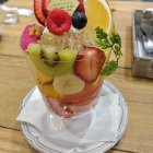 Colorful Fresh Cut Fruit Assortment in Large Glass Centerpiece