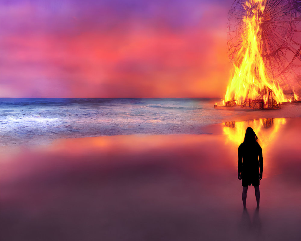 Twilight scene of person watching flaming Ferris wheel on beach