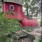 Illustration of multi-level house with red roof in enchanted forest