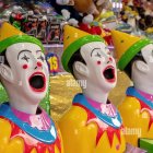 Colorful Clown Heads in Pool of Multicolored Balls