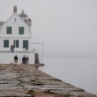 Scenic lighthouse at dusk on rocky shores