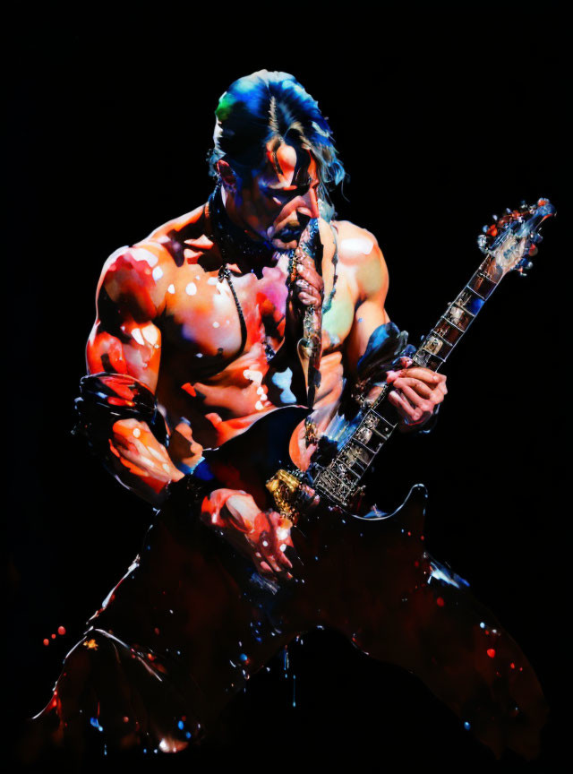 Shirtless male guitarist with body paint playing electric guitar against dark backdrop