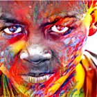 Person's Face Covered in Vibrant Paint Splatters