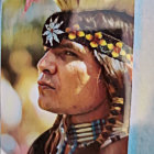 Person in Vibrant Native American Headdress Profile View