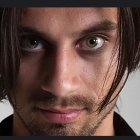 Intense-Eyed Man with Textured Skin and Beard in Digital Portrait