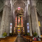 Modern Church Interior with White Columns and Stained Glass Windows