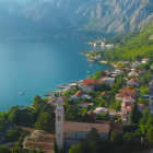 Colorful Coastal Landscape with Church, Trees, and Lake