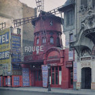 Vibrant winter street scene with windmill and vintage-dressed people