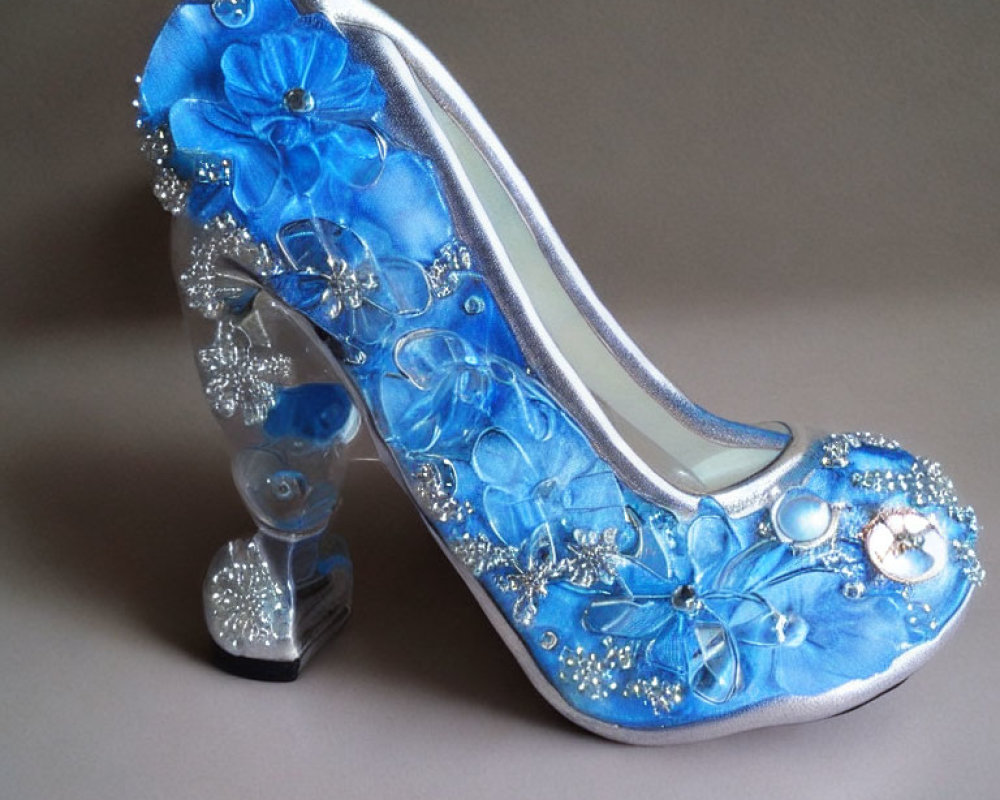 Blue High-Heeled Shoe with Floral Accents and Rhinestones