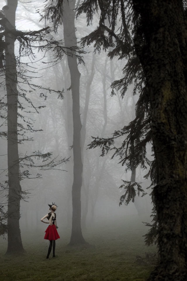 Person in Red Skirt and Deer Headpiece in Misty Forest