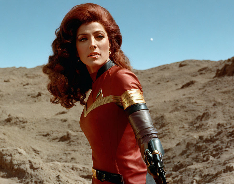 Woman in red superhero costume with wavy brown hair in deserted landscape