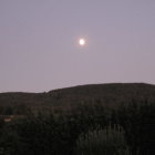 Nighttime Mountain Landscape with Starry Sky and Crescent Moon