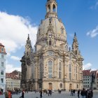 Baroque-style church with horse-drawn carriages in watercolor