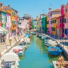 Colorful European Canal Town Painting with Boats and Charming Houses