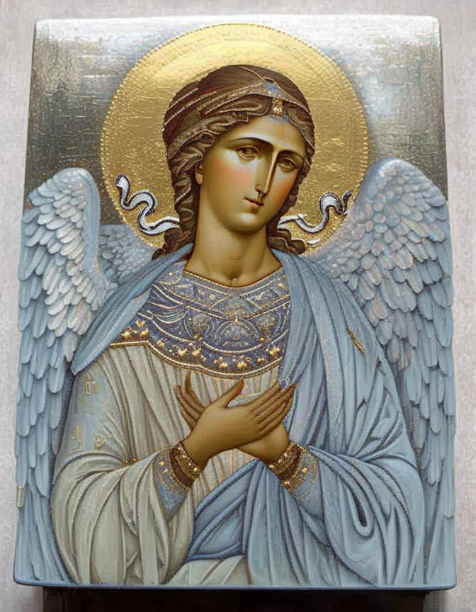 Traditional religious icon of an angel with halo and golden robes