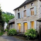 Charming two-story building with ivy and vintage lamp post on quaint street